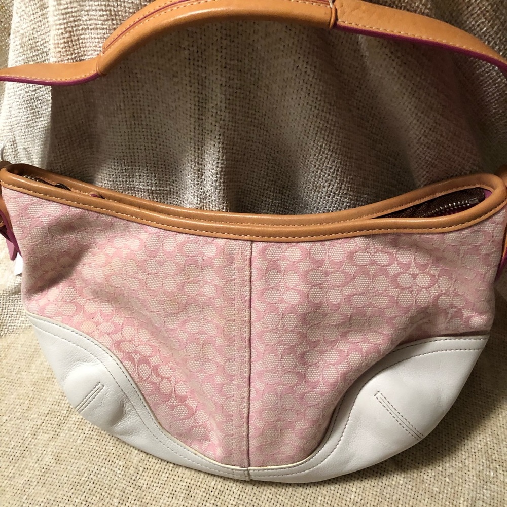 Small pink and white coach handbag